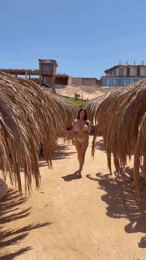 Big-titted solo babe in a bikini
