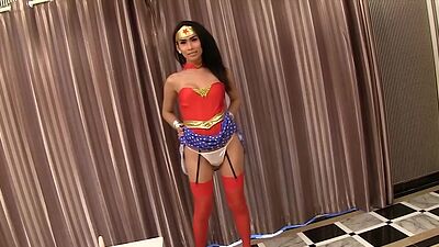 Wonder shemale slut Gor self ass fucking after posing in superhero costume