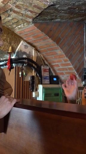 Busty Tattooed MILF Licking a Bally at the Pub