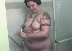 Tattooed plumper Christina in the shower