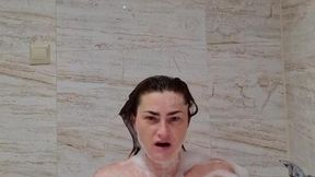 Girl loves her pussy and shows off gigantic tits in the shower
