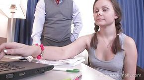 Tutor helps brunette babe to correct the mistakes in her assignment