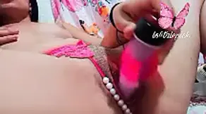 touches herself and masturbates with her dildo