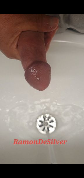 Master Ramon pisses and massages his hot cock in sexy silver satin shorts