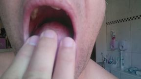 I spit on my fingers and slide them over my tongue