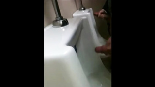 two slim dicks getting wanked at the urinals 7