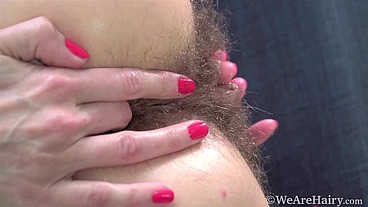 cutie sucks lollipops and sticks them in her hairy pussy, then plays with big labia and moans loudly from sweet pleasure GinnaGg