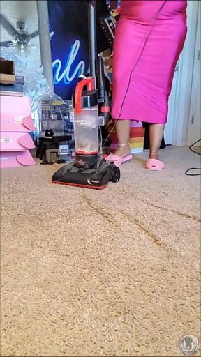 Slo mo vacuuming in pink fluffy slippers