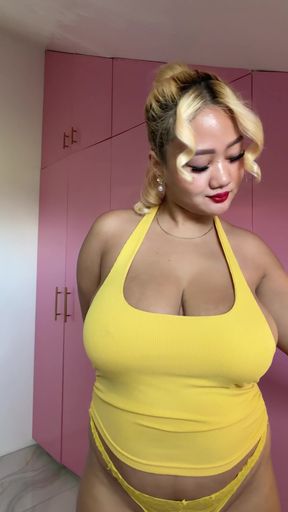 Curvy blonde in yellow swimsuit