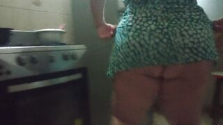 chubby stepmother into the kitchen preparing a lovely dinner