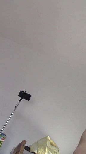 Amateur wife dancing naked at home. Amateur woman has fun trying on clothes and cutting them.   Clip 1
