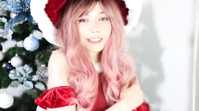 Cute Santa with big tits caresses her pussy under your Christmas Tree