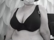 A mature BBW milf with big natural saggy tits tries on bras.