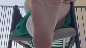 Bare feet of a giantess on holiday