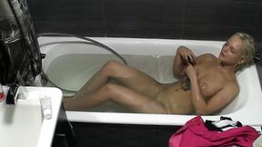 ”Watch my nude chick pleasure herself in the bathtub until she climaxes”