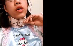 Asian Sissy's Small Cock Caged