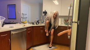 Crossdresser fucked with dildo in kitchen