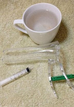 Anal enema using speculum