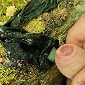 Outdoor cumshot in a used condom in the forest