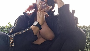 Beautiful italian milf shows you boobs while smoking in the garden