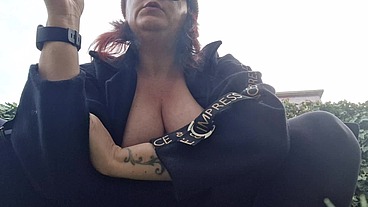 Beautiful italian milf shows you boobs while smoking in the garden