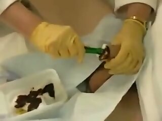 Doctor Inserting A Catheter In A Male Patient's Cock