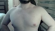 Muscular jock flexes on cam