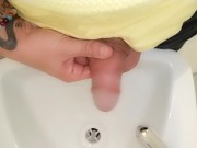 Peeing to the sink with uncut cock