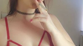 Smoking in my red bodysuit showing my ass