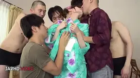 Sultry Japanese MILF gives an intense blow job in a hot threesome