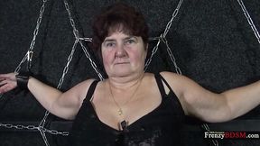 Chained chubby granny Hana gives a blowjob standing on her knees