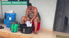African Mama Multitasks on a Sunday Morning