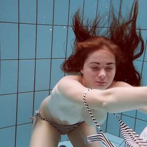 Watch the sexiest girls swim naked in the pool