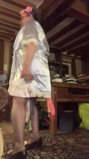 In uniform with a nightie and a negligee while listening to music