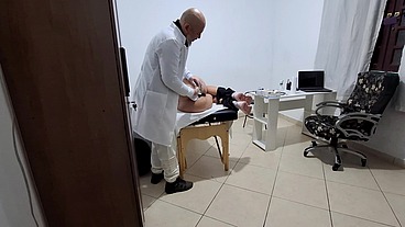 A MILF gets fingered by the proctologist during an anal exam.