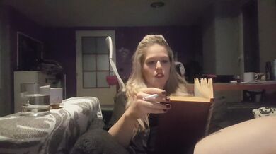 reading a book and smoking cigarette