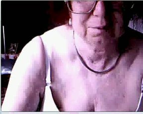 Ugly four eyed granny from Germany exposes her time worn cunt on webcam