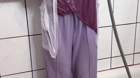 Purple outfit in shower and bathtub