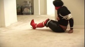 Gina elbow bound and traveling in red boots