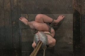 Small titted blondie tied with ropes is tortured in barn