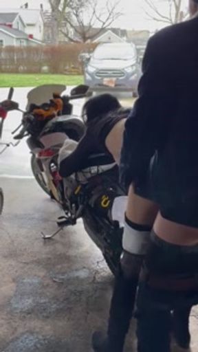 Chinese milf motorcycle needs repair roofers watching in background.