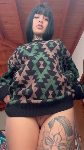 Female model in green and black sweater