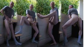Horny wanker outside on balcony wanks flaccid uncut cock as he strips gets erect penis shows asshole  proudly exposing himself