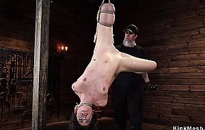 Brunette in one leg inverted suspension