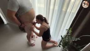 Young wife gives blowjob by the windows so neighbours could watch, get's facial