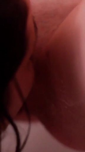 Key moment from &quot;Flicking the bean as the finger fucks her lesbian G spot in this super alluring bath sex&quot;