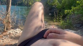 A guy on the beach decided to jerk off his cock while people were resting nearby and cumed from overexcitement