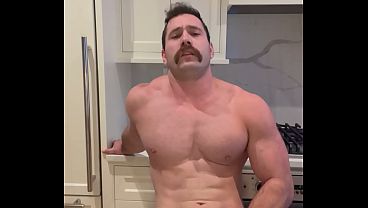 Austin Rex cumming while on the kitchen counter