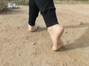 Super slow motion feet walking on dusty ground -- DIRTY FEET
