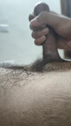 Indian man shows off his big cock while milking it